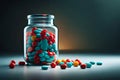 Colorful blue, red Pills capsules pouring out of the glass jar or bottle on wooden table background. Medicine concept Royalty Free Stock Photo