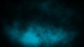 Colorful blue smoke on the floor . Isolated black background . Misty fog effect texture overlays for text or space Royalty Free Stock Photo