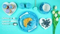 Colorful blue theme breakfast brunch table setting flatlay. Royalty Free Stock Photo