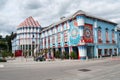 Colorful blue-white-red building of a luxury hotel in the Austrian town of Veit an d