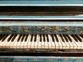 Colorful blue and yellow painted piano with a floral pattern. Royalty Free Stock Photo