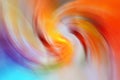 Colorful blurred gradient spiral vortex background. Red, orange, green, yellow, purple, blue mixed multicolor texture Royalty Free Stock Photo