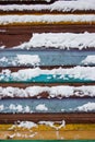 Colorful board covered with snow.