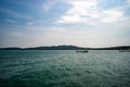 Colorful boat on seashore. Turquoise blue sea water near beach. Koh Rong island landscape. Cambodia travel photo. Exotic island Royalty Free Stock Photo