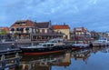 Colorful boats in the canals of Lemmer centrum, a historic port town in the Dutch province of Friesland, one of the most important