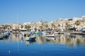 Colorful boats in european Marsaxlokk town in Malta