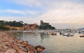 Colorful boats and seascape with old castle and blue cloudy sky with sunset in Lerici in Liguria, Italy Royalty Free Stock Photo