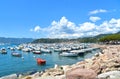 Colorful boats and seascape with old castle and blue cloudy sky with sunset in Lerici in Liguria, Italy