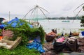 Colorful boats with tradional Chinese fishing nets at background in Cochin, Kerala, India Royalty Free Stock Photo