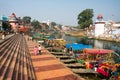 Colorful boats wait for the passengers at the river docks of indian city