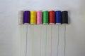 Colorful bobbins on white background