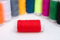 Colorful bobbins on white background