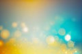 Colorful bokeh lights out of focus, abstract background with glowing dots in shades of blue and yellow Royalty Free Stock Photo