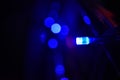 Colorful bokeh pattern formed on a black background by series of colorful led lights during a festival in India. Abstract light Royalty Free Stock Photo