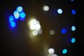 Colorful bokeh pattern formed on black background by series of colorful led lights during a festival in India. Abstract light Royalty Free Stock Photo