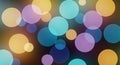 Colorful bokeh-style circles overlap on a dark background, creating an abstract visual. Royalty Free Stock Photo