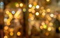 Colorful bokeh with yellow tint as blurry background Royalty Free Stock Photo