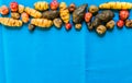 Colorful Bolivian and Peruvian potatoes and tubers against colored background Royalty Free Stock Photo