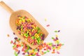 Colorful bonbons mix in wooden spoon Royalty Free Stock Photo