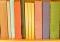 Colorful book arrange on wooden shelf Royalty Free Stock Photo