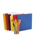 Colorful Books Standing Tall With Pens and Pencils Royalty Free Stock Photo