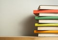 Stack of colorful books on wooden desk. Copy space for text. Back to school. Education background Royalty Free Stock Photo