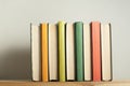 Stack of colorful books on wooden desk. Copy space for text. Back to school. Education background Royalty Free Stock Photo