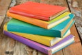 Colorful Books on Wooden Table. Generative AI Royalty Free Stock Photo