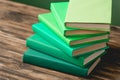 Colorful books on wooden textured surface Royalty Free Stock Photo