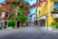 Colorful bougainvillea flowers on the wall, Sirmione, Lombardy region, Italy