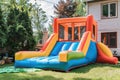 Colorful bouncy castle slide for children playground. Generative AI. Royalty Free Stock Photo