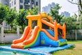 Colorful bouncy castle slide for children playground. Generative AI. Royalty Free Stock Photo