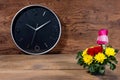 Colorful Bouquet with clock on wood background Royalty Free Stock Photo