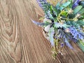 Colorful bouquet of gentle spring flowers placed on a rustic wooden table. Background, place for text, copy space Royalty Free Stock Photo