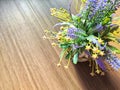 Colorful bouquet of gentle spring flowers placed on a rustic wooden table. Background, place for text, copy space Royalty Free Stock Photo