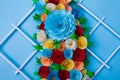 Colorful bouquet made with paper on a blue surface Royalty Free Stock Photo