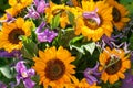 Colorful bouquet with summer flowers and yellow sunflowers in gr Royalty Free Stock Photo
