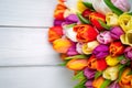 Colorful bouquet of tulips on white wooden background. Spring flowers. Royalty Free Stock Photo