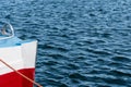 Colorful bow of a boat in rippled water Royalty Free Stock Photo