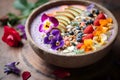 A colorful bowl with fruits, berries and flowers