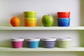 Colorful bowls on a kitchen shelf Royalty Free Stock Photo