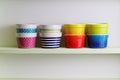 Colorful bowls on a kitchen shelf Royalty Free Stock Photo