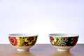Colorful bowls on the table on white background Royalty Free Stock Photo