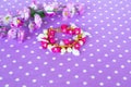 Colorful bracelet with beads and plastic flowers and leaves Royalty Free Stock Photo
