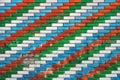 Colorful brick wall with diagonal pattern with white, blue, red and green colors Royalty Free Stock Photo