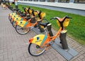 Colorful and bright Aviva bicycles at parkinkg, available for rent. Public transportation concept Royalty Free Stock Photo