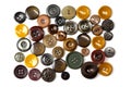 Colorful bright brown, beige and ochre buttons background. Old vintage buttons close-up. Top view. Background of buttons in Royalty Free Stock Photo