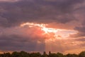 Colorful sunset with beams shining through clouds Royalty Free Stock Photo