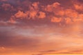 Colorful bright golden and pink clouds in blue heaven on sunset as abstract background, texture. Royalty Free Stock Photo