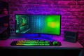 colorful bright illuminated rgb gaming pc keyboard mouse monitor green screen copy space front led light brick stone wall computer Royalty Free Stock Photo